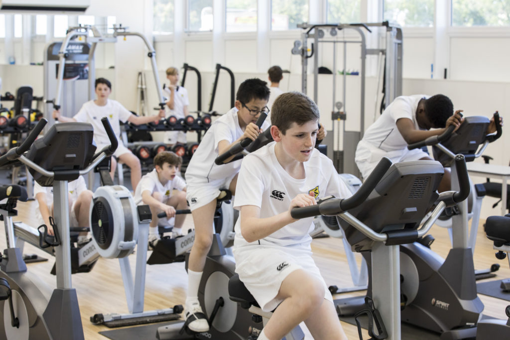 A group of students exercising in the school gym