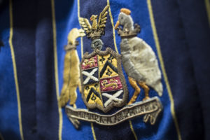 Close up of the SJWMS logo on a school blazer