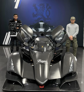 Ruben is pictured alongside a friend, posing for the camera with a Formula 1 racing car.