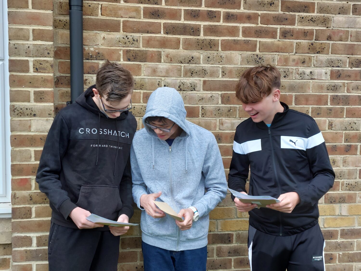 Michael, Christopher and George opening their results