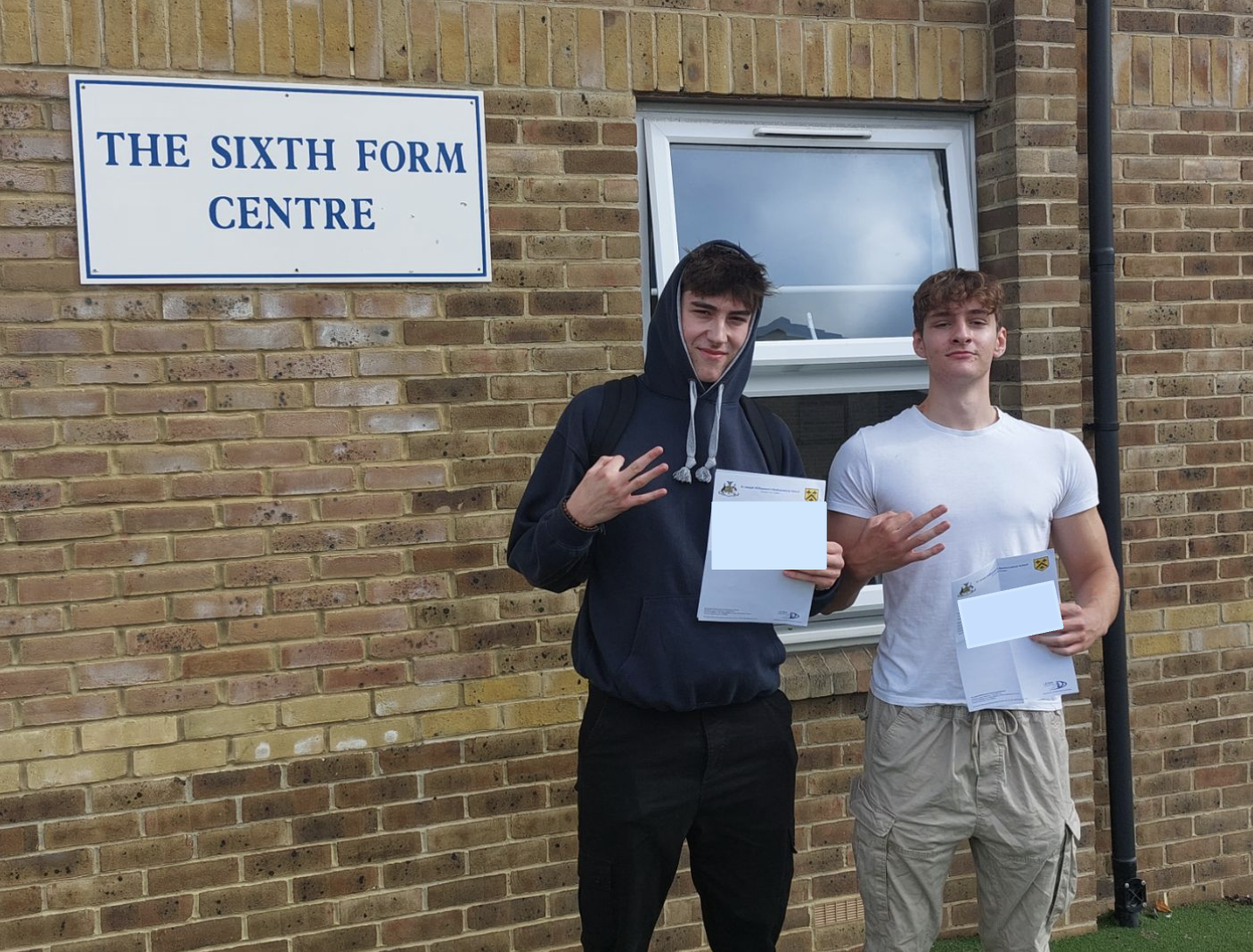 Dominic and Monty holding their results