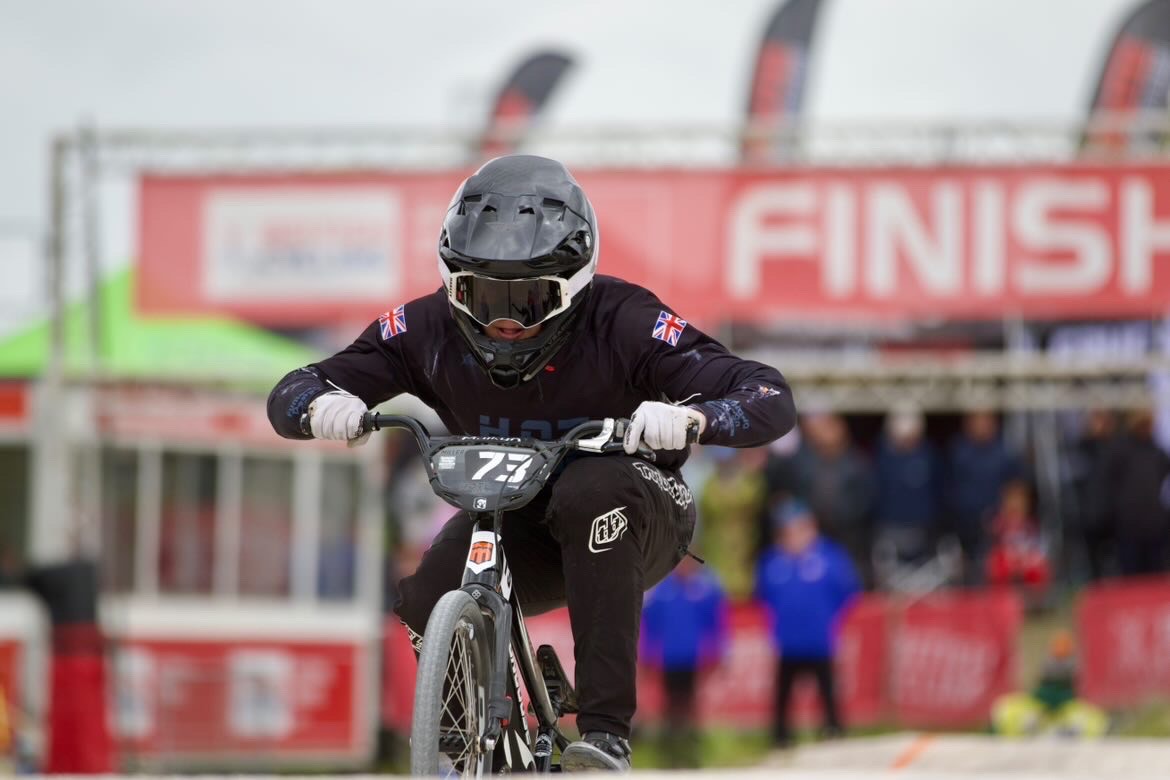 Year 12 student, Miller, is seen performing a stunt in mid-air on his BMX bicycle on a race track during the National BMX Championships.