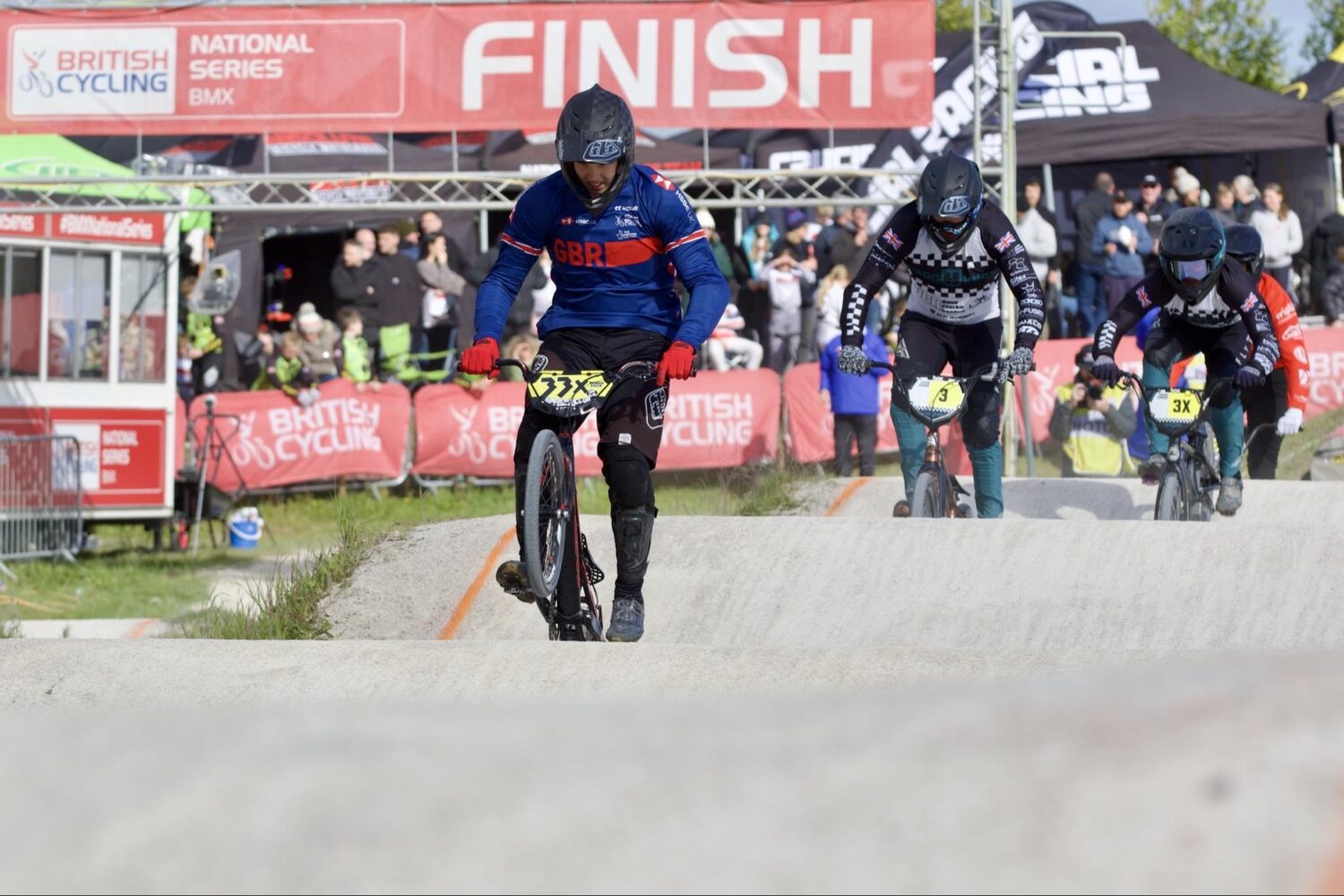 A young man is seen leading the way on his BMX bicycle during a race in the National BMX Championships.